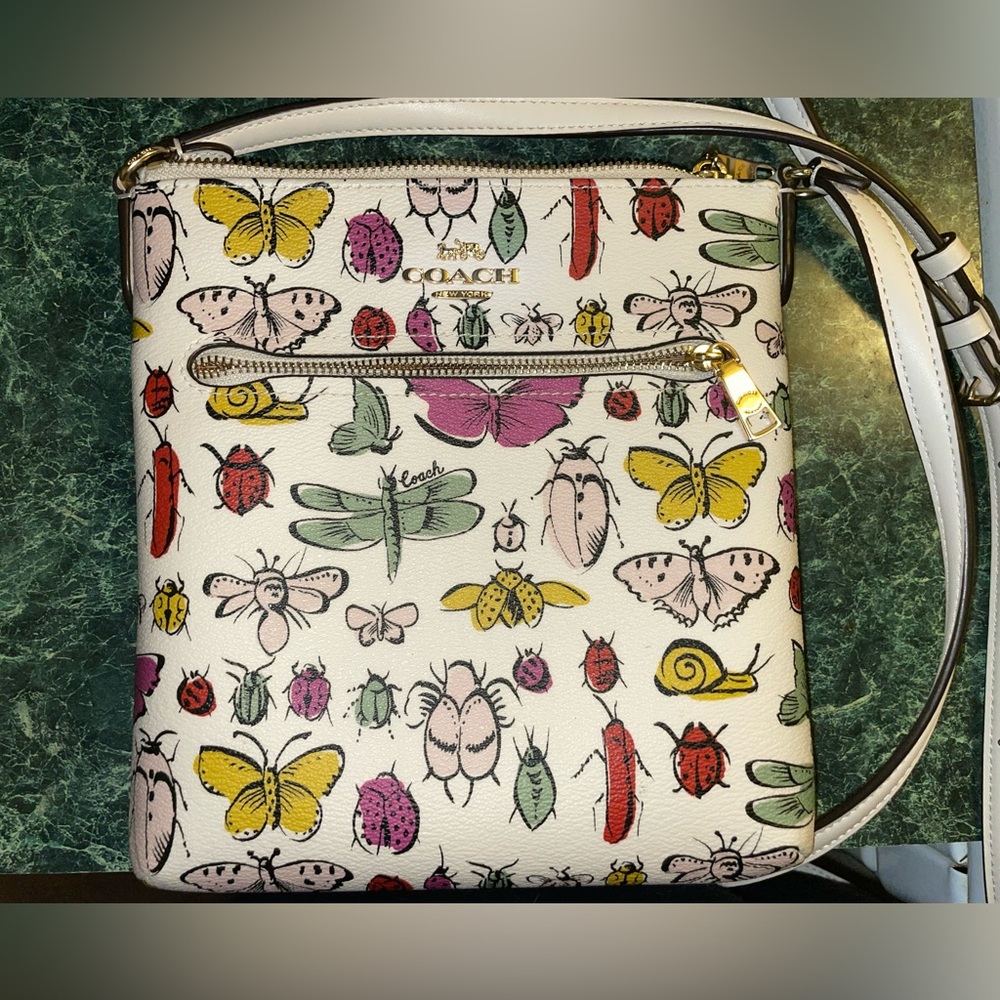 Coach Mini Rowan File Bag With Creature Print. Good condition. Used